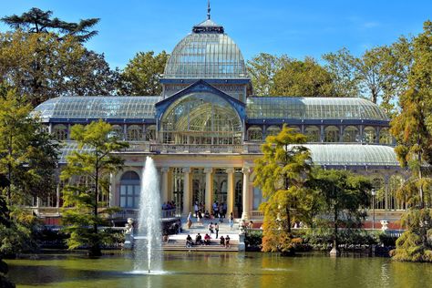 Three years after finishing Velázquez Palace, Ricardo Velázquez Bosco was the architect for the Crystal Palace. The glass, domed structure was inspired by London’s Crystal Palace. Initially, it was designed as a giant greenhouse for displaying exotic plants from the Philippines. Today, Palacio de Cristal is used by the Reina Sofia Museum for occasional exhibits. … Giant Greenhouse, Crystal Palace Madrid, Reina Sofia Museum, Retiro Park, The Crystal Palace, Dome Structure, The Architect, Crystal Palace, Exotic Plants