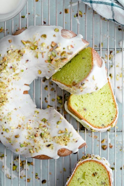 Easiest bundt cake recipe! This pretty green pistachio pudding cake is unfailingly soft and tender, studded with chopped pistachios, and glazed with a sweet and shiny white icing. It's an embarrassingly easy cake recipe to bake.   #baking #desserts #cake #AndieMitchell Pistachio Pudding Cake, St Patrick's Day Dessert, Easy Bundt Cake Recipes, Pudding Frosting, Easy Bundt Cake, Easy Cake Recipe, Pistachio Recipes, Bundt Cake Recipe, Pistachio Pudding