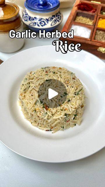 Megha Mahindroo | Recipe Video Creator on Instagram: "Garlic Herbed Rice is a perfect way to use left over cooked rice and elevate the taste of your meal✨❤️  Here is what all you need:   Cooked rice  Finally, chopped garlic  Chilli flakes  Oregano  Black pepper  Salt  Coriander leaves  Butter   (Recipe, herbed rice, fried rice, leftover rice recipe, easy rice recipe, simple use of rice, quick recipe)   #recipe #rice #herbedrice #garlicrice #explore #butter #herb #mixedherbs #reelitfeelit #explorepage #ricerecipe" Rice With Herbs Recipe, Herb Rice Recipes, Butter Garlic Rice Recipe, Herb Rice Recipes Simple, Garlic Herb Rice Recipe, Lemon Garlic Herb Rice, Lemon And Herb Rice, Garlic Rice Recipes, Garlic Butter Rice