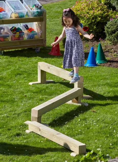 Promote physical development with the Millhouse Outdoor Balance Beam Set. Designed to challenge young children, the set features 3 beams with different heights to offer challenge and build confidence.  • Beam heights 150mm(H), 250mm(H), 350mm(H) • Made using premium quality Scandinavian Redwood • Surfaces sanded smooth to ensure no splinters • Rounded corners for enhanced safety • Manufactured in the UK • Fully reconfigurable • Specially treated timber guaranteed for Lifetime W1200 x H150,250,35 Diy Balance Beam, Kids Outdoor Playground, Treated Timber, Physical Activities For Kids, Diy Playground, Balance Beam, Outdoor Play Area, Climbing Frame, Nature Play