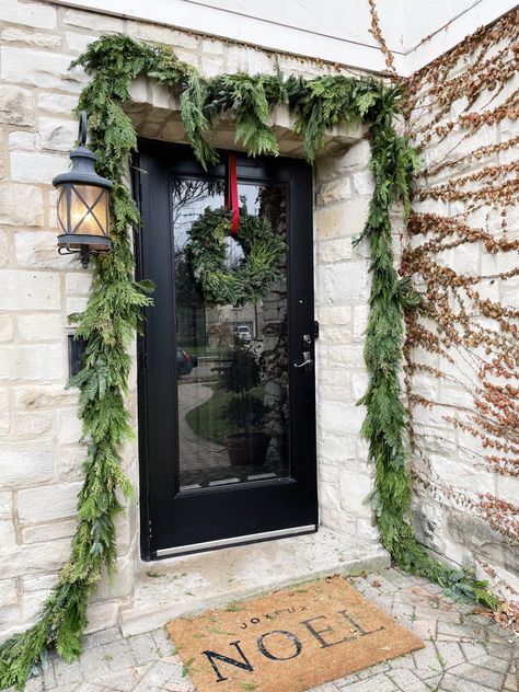 Porch Garland, Outdoor Garland, Fresh Garlands, Front Door Christmas Decorations, Pine Garland, Christmas Front Doors, Holiday Garlands, Hanging Garland, How To Hang