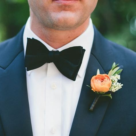 The groom's boutonniere will be an orange ranunculus, pink astilbe and green bay laurel wrapped in navy ribbon with the stems showing. Navy Orange Wedding, Indian Wells California, Orange Boutonniere, Ranunculus Wedding Bouquet, Ranunculus Boutonniere, Peach Ranunculus, Orange Ranunculus, Navy Ribbon, Wedding Boutonnieres