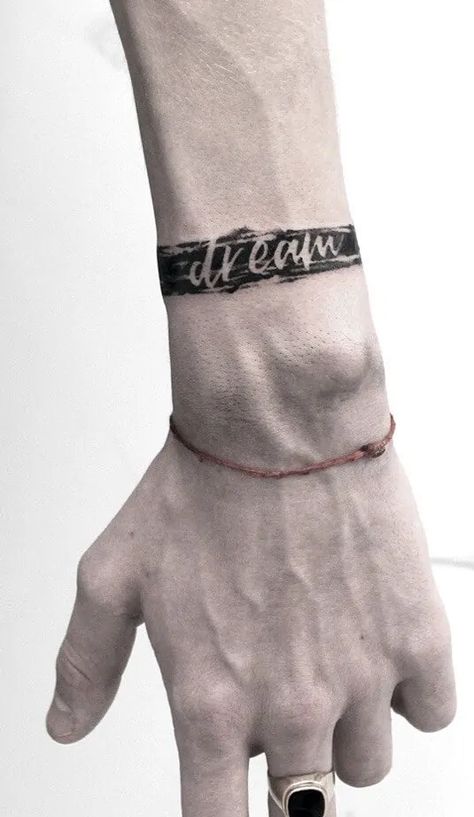 Everything You Need To Know Before Getting A Lettering Tattoo Bracelet Tattoo For Man, Leg Band Tattoos, Wrist Band Tattoo, Band Tattoos For Men, Unique Wrist Tattoos, Cuff Tattoo, Skull Hand Tattoo, Band Tattoos, Forearm Band Tattoos