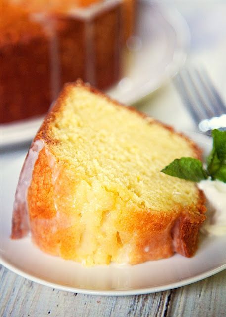 Lemon Sour Cream Pound Cake - the most AMAZING pound cake I've ever eaten! So easy and delicious! Top the cake with a lemon glaze for more yummy lemon flavor. Serve the cake with whipped cream, mint and fresh berries. I took this to a party and everyone asked for the recipe! Lemon Sour Cream Pound Cake, Lemon Sour Cream Cake, Lemon Pound Cake Recipe, Sour Cream Pound Cake, Sour Cream Cake, Cake Recipes From Scratch, Lemon Pound Cake, A Piece Of Cake, Bundt Cakes Recipes