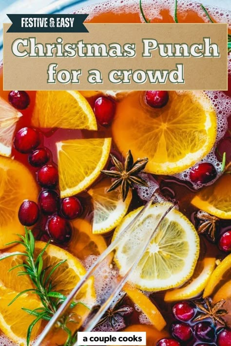 his delicious Christmas Punch recipe is fruity and delicious! Make it with rum for a punch with alcohol, or omit for non alcoholic. #christmas #christmaspunch #punch #nonalcoholicpunch #alcoholicpunch Christmas Punch For A Crowd, Holiday Cocktails Thanksgiving, Punch For A Crowd, Christmas Party Punch, Non Alcoholic Christmas Punch, Cocktails Thanksgiving, Rum Swizzle, Spiced Cocktail, Holiday Punch Recipe