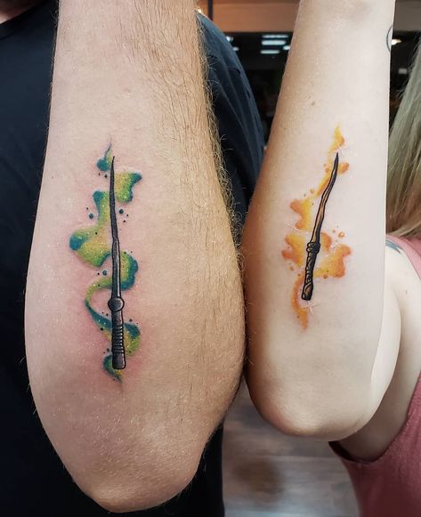 If you're a couple who loves Harry Potter, team up and get a matching tattoo. From subtle wands to Deathly Hallows symbols, the ideas are endless. Matching Harry Potter Tattoos, Hufflepuff Tattoo, Tiny Harry Potter Tattoos, Slytherin Tattoo, Maching Tattoos, Tattoos For Couples, Wand Tattoo, Matching Friend Tattoos, Hp Tattoo