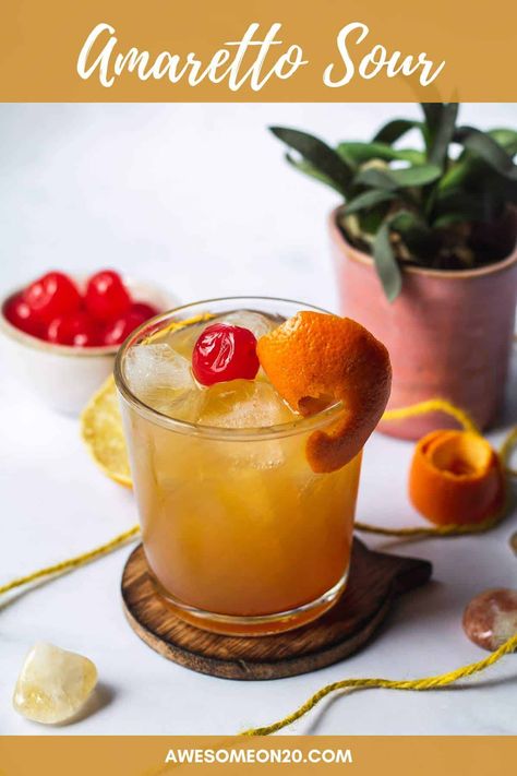 An Amaretto Sour is a classic cocktail for a good reason. It's extremely simple to make with only two ingredients, and it's deliciously tart. You'll want to sip one all the time. #cocktailrecipe #easycocktails #amarettosour Amerreto Sour Recipes, Amaretto Sour Recipe Easy, Ameretto Sour, Amaretto Sour Recipe, Amaretto Sour, Classic Cocktail, Easy Cocktails, Maraschino Cherry, Classic Cocktails