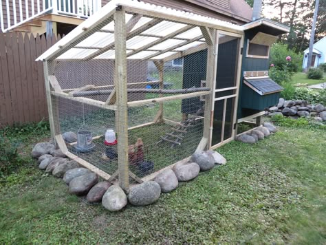 The door to the run is a pre-made screen door that I bought for $20 and cut about 10" off the top to fit the run. I also added 2"x3" wire to the door. The run is fully covered with chicken wire, including a 1' wide apron under the stones. The lower half of the run also has 2"x3" fencing. The roof of the run us white corrugated plastic roofing panels. | BackYard Chickens - Learn How to Raise Chickens Urban Chicken Farming, Plastic Roofing, Portable Chicken Coop, Backyard Chicken Coop Plans, Chicken Pen, Diy Chicken Coop Plans, Chicken Coop Run, Urban Chickens, Backyard Chicken Farming