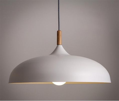 an look and organic form of this beautiful ceiling light. The combination of white or black with a wooden crown gives it a distinctly scandinavian feel that is so popular for its combination of simplicity and warmth. A black and white textile hanging cord adds further detail and interest. Great for bring Scandinavian Light Fixtures, Lighting Scandinavian, Kitchen Pendant Lights, Kitchen Nordic, Scandinavian Light, Nordic Vintage, Lampe Art Deco, Modern Hanging Lights, Scandinavian Lighting