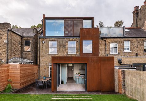 View from the rear garden of a metal clad rear and roof extension to a victorian terrace house Red Brick Kitchen, Barn Conversion Exterior, Brick Extension, Terrace Home, Clubhouse Design, Architectural Portfolio, Bespoke Staircases, Creative Design Ideas, Steel Cladding