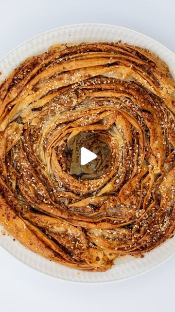 Antoniou Fillo Pastry on Instagram: "BAKLAVA SOUFRA. Looking for a quick and easy dessert to make for festive celebrations? Our baklava soufra is a great option. Watch along to see how we fold our Fillo Pastry in a concertina design and form it into a beautiful spiral. This beautiful version of Baklava is super crunchy, super 
delicious and super easy to make! Head to our website for the recipe, there is a link in our Instagram bio. Here is the direct link which you can copy into your internet browser:
https://antonioufillo.com.au/blog/recipes/baklava-soufra-crinkle-cake

#baklava #baklavasoufra #soufra" Crinkle Cake, Dessert To Make, Easy To Make Desserts, Phyllo Dough, 10k Views, Desserts To Make, Easy Dessert, Instagram Bio, Baklava