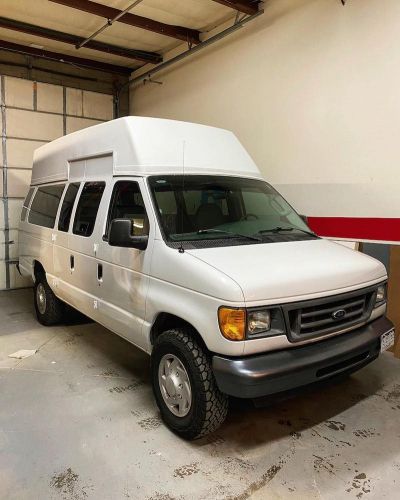 Ford Econoline with Raised Fixed Bed and Full Interior Kitchen Ford Econoline Van Conversion Interior, Econoline Van Conversion, Ford Econoline Van Conversion, Camper Van Kitchen, Ford Econoline Van, Surfboard Storage, Chevy Astro Van, Dodge Ram Van, Econoline Van