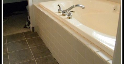 We wanted to give our outdated bathtub a fresh new look without breaking the bank. After giving it some thought, we decided to leave the existing tile in place,… Update Garden Tub Master Bath, Garden Tub Update, Shiplap Around Tub, Garden Tub Makeover, Garden Tub Remodel, Garden Tub Decor, Garden Tubs, Painted Staircase, Bath Surround