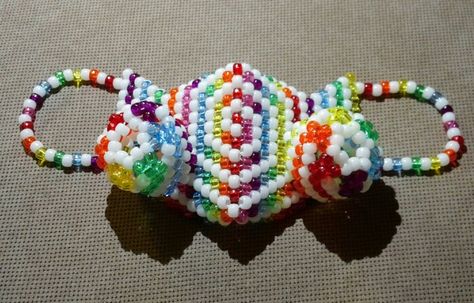 GID swirly rainbow gas mask Kandi Gas Mask Tutorial, Kandi Gas Mask, Kandi Mask Patterns, Kandi Mask, Kandi Cuff Patterns, Kandi Inspo, Diy Kandi Bracelets, Pony Bead Crafts, Diy Kandi