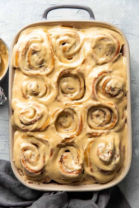 You will love these warm pumpkin cream cheese cinnamon rolls! They are perfect for fall. They boast swirls of fluffy, soft cinnamon dough with luscious, pumpkin cream cheese frosting on top. Ambitious Kitchen Cinnamon Rolls, Fall Cinnamon Rolls Aesthetic, Gourmet Cinnamon Rolls Recipes, Pumpkin Cheesecake Cinnamon Rolls, Grinch Cinnamon Rolls, Fancy Cinnamon Rolls, Pumpkin Cinnamon Rolls Homemade, Fall Cinnamon Rolls, Cream Cheese Cinnamon Rolls