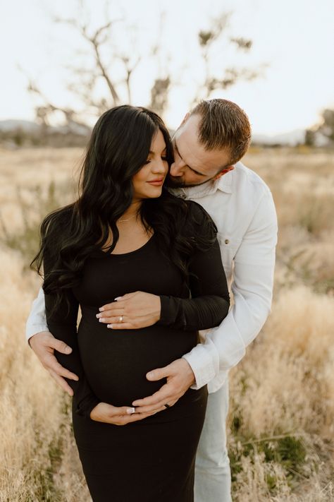 Maternity photoshoot outfit idea Maternity Session Black Dress, Maternity Photography Mens Outfit, Christmas Maternity Pictures Couple, Pregnant Fall Wedding Guest Outfit, Maternity Christmas Card Family Pictures, Black Sweater Dress Maternity Photos, Raining Maternity Photos, Maternity Pics Outside, Foggy Maternity Photos