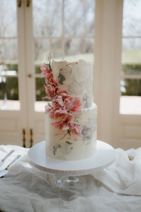 This 2- tiered wedding cake is so modern and unique with the white and grey marble looking icing. The coral floral design that climbed around the cake was so stunning and brightened up the entire cake. Pink Champagne Cake, White And Grey Marble, Modern Birthday Cakes, Simple Cakes, Champagne Cake, Wedding Aesthetics, Special Cakes, Modern Birthday, Amazing Wedding Cakes