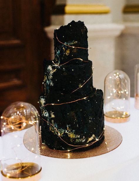 We're Over the Moon for All These Celestial-Inspired Wedding Details | Green Wedding Shoes Wedding Cake Crystal, Glass Wedding Cake Toppers, Wedding Cake Stars And Moon, Unique Wedding Dresses Different Colour, Black Green Wedding Dress, Dark Wedding Inspiration, Celestial Gothic Wedding, Witch Wedding Cake, Sun And Moon Wedding Cake