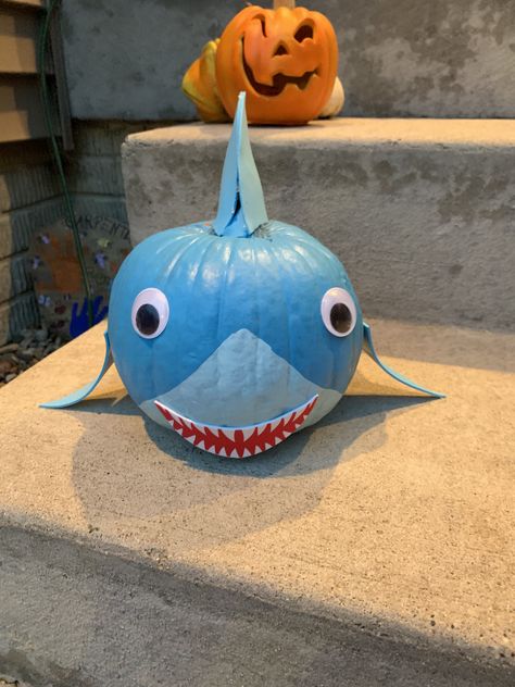 painted Baby Shark Do-Do-Do pumpkin with shark fins #paintedpumpkins #babysharkdoodoo #halloweenpumpkins Shark Pumpkin Decorating, Shark Pumpkin Painted, Baby Shark Pumpkin, Shark Pumpkin Carving, Shark Pumpkin, Pumpkin Creations, Easter Wreath Craft, Streets In Paris, Frame Windows