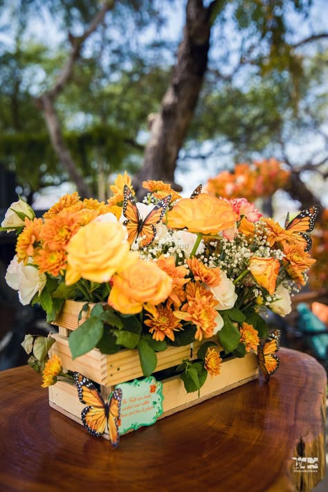 Butterfly Garden Party Centerpieces, Monarch Party Theme, Orange Theme Table Decor, Orange Theme Centerpieces, Monarch Butterfly Birthday Party Decorations, Orange Flower Centerpieces Wedding, Floral Arrangements With Butterflies, Monarch Butterfly Centerpiece, Orange Theme Quinceanera