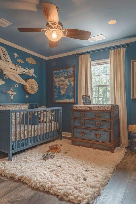 Sky High captures the vastness of the blue skies and is an airy and light nursery room idea for a boy. Decorated with clouds, airplanes, and soft blues, it encourages dreams of flying and adventure. The theme can be both calming with its pale palette and inspiring with elements that suggest travel and freedom. Accents like hanging mobiles that mimic airplanes can be both visually stimulating and soothing for infants. A mural of the sky can serve as a beautiful focal point. Click or tap to see mo Switzerland Home, Toddler Bedroom Ideas, Adventure Theme Nursery, Maximalist Living Room, Adventure Room, Light Nursery, Travel Theme Nursery, Airplane Nursery, Nursery Room Ideas