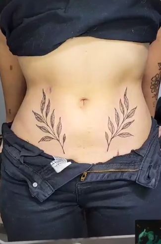 Hip Leaf Tattoos Women, Small Belly Button Tattoos For Women, Belly And Hip Tattoos, Leaves Stomach Tattoo, Tattoo Tummy Lower Stomach, Leaves On Hip Tattoo, Vine Tattoos Stomach, Hip Leaf Tattoo, Leaf Stomach Tattoo