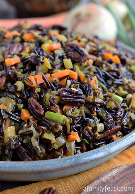 The best Wild Rice recipe! Tender wild rice tossed with vegetables, currants and pecans and cooked in an orange-vermouth broth. Very delicious! Wild Rice Recipes Side Dishes, Wild Rice Recipe, Rice Recipes Side, Wild Rice Recipes, Wild Rice Casserole, Rice Side Dish Recipes, Cooking Wild Rice, Wild Rice Salad, Rice Side Dishes