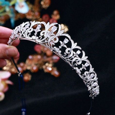 Up your sparkle factor with this new tiara design that can complete the most sophisticated of bridal looks. Intricately faceted clear crystals work their way across the band in a swirly pattern, while the micro-pave technique used to set the smaller stones creates a stunning halo effect.Cast in lightweight alloy and rhodium plated for a flawless finish, the headband measures 1.4" at the highest point (approx. 3.5cm) and 6" in diameter (approx. 15cm). Two small loops at each end make it easy to attach to your hair with bobby pins. Its incredible sparkle coordinates with any color wedding dress or formal ensemble. Tiara Design, Color Wedding Dress, Hair With Bobby Pins, Swirly Pattern, Halo Effect, Color Wedding, Colored Wedding Dresses, Bridal Tiara, Clear Crystals