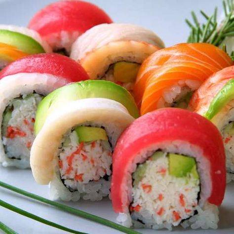 Rainbow Roll •  An assortment of fish and avocado on top of a California Roll.                                                                                                                                                                                 More Rainbow Roll Sushi, Sushi Etiquette, Types Of Sushi Rolls, Resep Sushi, Dessert Sushi, Rainbow Roll, Types Of Sushi, Sushi Love, Sushi Recipes