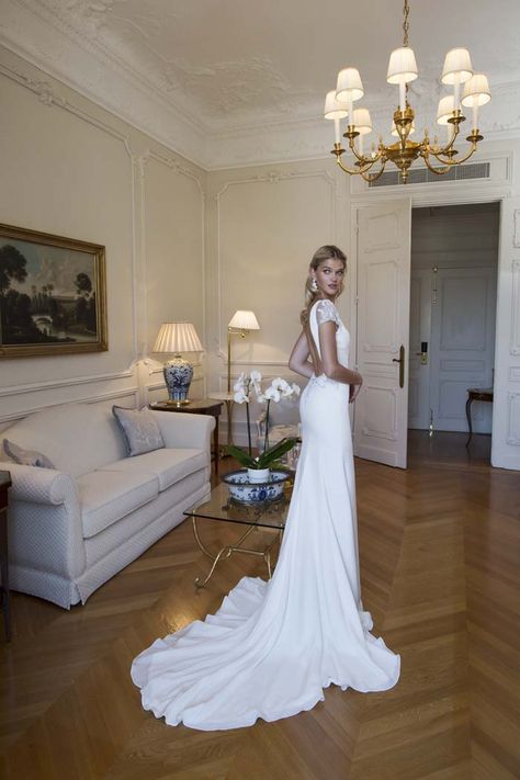 Deep V Cap Sleeve Wedding Dress, Open Back Short Sleeve Wedding Dress, Short Sleeve Low Back Wedding Dress, Classy Unique Wedding Dresses, Short Sleeve V Neck Wedding Dress, Short Sleeve Open Back Wedding Dress, Wedding Dresses With Low Back, Wedding Dress With Buttons Down The Back, Architectural Wedding Dress