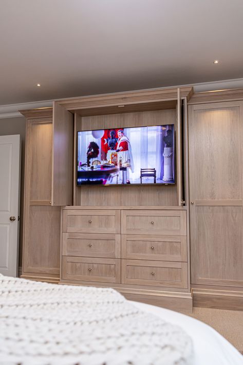 Seamlessly blending technology and design, our custom cabinets with built in TV and pocket doors create the perfect bedroom escape. #LuxuryHomes #GrandDesigns #BespokeDesigns #HighEndInteriors #InteriorDesign #MediaWall #MediaWallDesign #ElegantSpaces #ExclusiveDesigns #AV #AVGeek #LuxuryEvents #ExclusiveEvents #TVWallDesign Dresser Cabinet Bedroom Built Ins, Built In Closet With Tv Bedroom, Wall Closet With Tv Master Bedrooms, Built In Closet Wall Bedroom With Tv, Diy Built In Cabinets Bedroom, Tv Hidden In Cabinet, Hidden Tv Built In, Bedroom Built In Wardrobe With Tv, Built In Closet With Tv