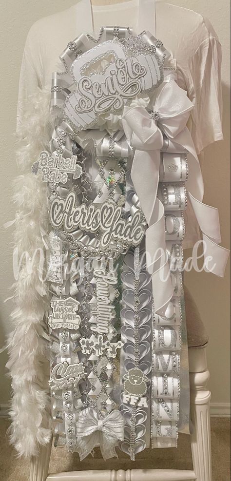 homecoming mum
white and silver homecoming mum
senior homecoming mum
hoco mum
senior mum
morgan made mums Homecoming Mum Junior Ideas, Homecoming Mum Inspiration, Junior Hoco Mum, Homecoming Senior Mums, Texas Shaped Mums Homecoming Senior, White Homecoming Mum, Big Mums Homecoming, All White Mums Homecoming, Senior Year Homecoming Mum