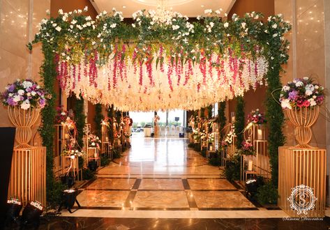 A statement ceiling elevated the aura of this event, right from the entryway to the reception hall. #SamaniDecorators #themedecor #weddingdecor #decorideas #weddingdecoration #decorinspiration #inspiration #decorinspo #weddings #indianweddings #bigfatindianwedding #weddingday #engagementdecor #mehendidecor #eventplanners #weddingplanners #eventmanagement #reception #weddingsutra #wedmegood #destinationwedding #destinationdecor #eventdecor #eventplanning Entryway Decor Indian Wedding, Event Entrance Design Entryway, Indian Wedding Entrance Decor, Wedding Entrance Decor Entryway, Indian Wedding Entrance, Entrance Decor Wedding, Wedding Mandapam, Event Entrance Design, Stage Decoration Photos