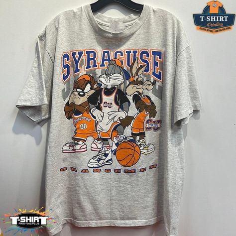 Vintage Ncaa Syracuse Orange Looney Tunes Shirt, Syracuse Orange Shirt, Syracuse University, Unisex T-Shirt Sweatshirt Hoodie, Vintage Shirt Our Classic T-Shirt Serves As The Perfect Short-Sleeved Shirt For Your Unique, Funny, Or Personalized Designs. Brand: Gildan Heavy Weight Fabric Classic Unisex Makes This An Easy Fit Size Up If You Want Something Roomier Our Shirts Materials: 100% Cotton ** Note: - Double Check Your Address Before Ordering. - If You Want To Return The Goods, You Are The One Looney Tunes Shirt, Syracuse University, University Shirt, Orange Shirt, Cotton Hoodie, Vintage Shirt, Looney Tunes, Cool Tees, Sports Shirts