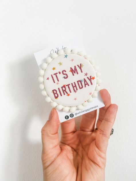 Let everyone know that it's your birthday with this super cute fabric badge with a pom pom trim. The badge measures  approx. 5.8 cm in diameter.  SAFETY FIRST: children must be supervised at all times when wearing a badge as they contain small parts and sharp pins. This product is made to order. CARE FOR YOUR PRODUCT by Wipe clean only  DISCLAIMER: this is a handmade item, there may be imperfections. Postage disclaimer  Stand alone badge orders are sent out Royal Mail 1st class. All orders are s Sewing Bunting, Birthday Fabric, Birthday Pins, The Badge, Birthday Badge, Cute Fabric, It's My Birthday, Sewing Projects For Kids, Due Date