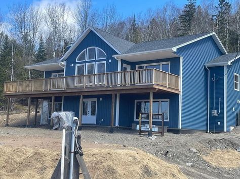 Here we go with another gorgeous home Built With Kaycan! Our new Cabot Blue coming in hot on this build by Cathline Contracting Ltd! Looks great in siding and board and batten 👌 If you want to learn more about your blue vinyl siding options, download our Ultimate Blue Siding Guide! Link in Bio! We love to see you using our products in the incredible homes and projects you build! 🙌 @cathlinecontracting #vinylsiding #siding #boardandbatten #CabotBlue #builtwithkaycan Dark Blue Vinyl Siding House, Dark Blue Vinyl Siding, Bayou Blue Vinyl Siding House, Light Blue Vinyl Siding House, Vinyl Siding Options, Cabot Blue Vinyl Siding, Blue Vinyl Siding, Blue Siding, Siding Options