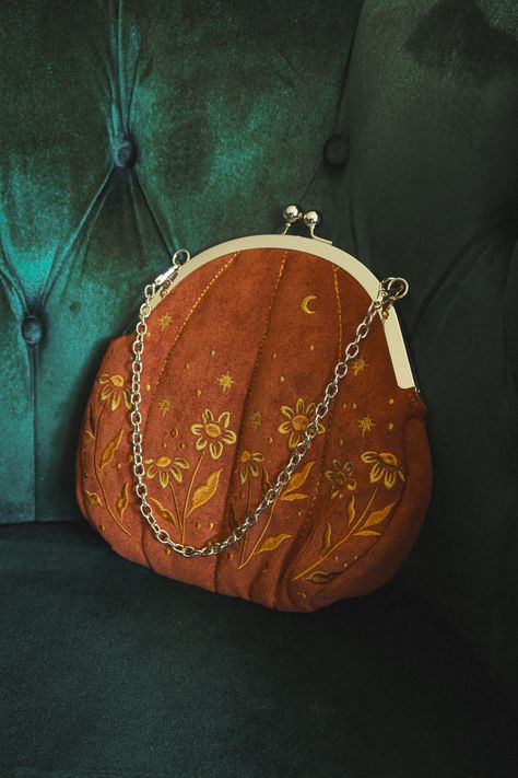 This orange velvet embroidered purse is perfect for an autumn aesthetic vibe and fall outfits. Made with soft fabric and high quality metal hardware. Embroidered on both sides.   Designed in and shipped from California.   #autumnaesthetic #fallvibes #fallaesthetic #falloutfits #fallfashion #fallstyle #pumpkinpatchoutfit #pumpkins Witch Bag Aesthetic, Orange Witch Aesthetic, Autumn Aesthetic Pumpkin, Green Witch Aesthetic, Aesthetic Pumpkin, Embroidered Purse, Pumpkin Patch Outfit, Summer Goth, Aesthetic Dark Academia