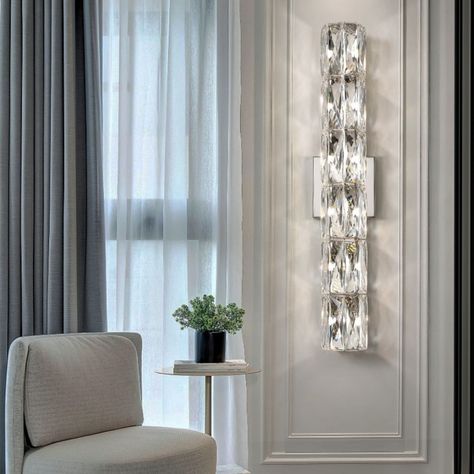 This Cylindrical Crystal Wall Lamp sconce is made of stainless steel and crystal material, and it is not easy to rust or fade. The shade is made of polygonal sparkling crystal material, which makes the shining light look beautiful, and it is creating a comfortable and elegant atmosphere in your house. You can fix it to the wall for stability and space saving. The wall light fixture is perfect for the living room, dining room, bedroom, study, aisle, kitchen and other places. . . Find the lamp ... Modern Fireplace Ideas Living Rooms, Long Lamp, Bracket Lights, Crystal Wall Lighting, Crystal Wall Sconces, Long Walls, Light For Living Room, Hotel Villa, Modern Fireplace