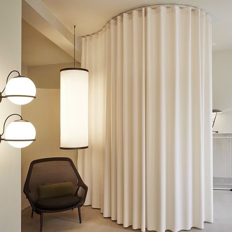 Stilling | All Stilling tracks are made-to-measure and can be curved to create spaces within spaces. Here is an elegant solution from the… | Instagram Curtains On Curved Window, Curved Windows Curtains, Curtains Curved Window, Curtain Showroom Design, Soft Curves Interior, Curved Curtain Track, Rounded Window Curtains, Curtain Wardrobe, Curved Curtain