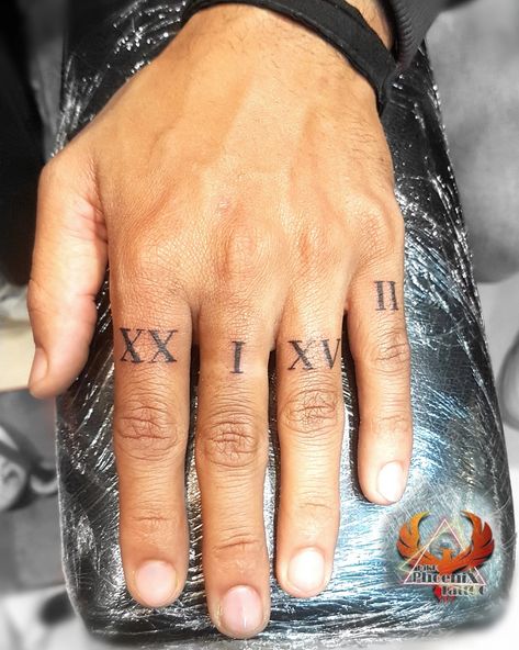 Roman Numerals Finger Tattoo, Roman Numeral Tattoo On Finger, Greek Mythology Finger Tattoos, Finger Roman Numeral Tattoo, Date On Finger Tattoo, Roman Numeral Hand Tattoo, Numbers On Fingers Tattoo, Greek Numbers Tattoo, Roman Numeral Tattoo Finger