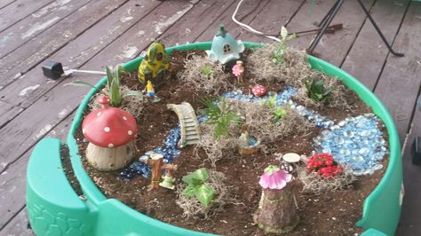 Turtle Kiddie Pool turned Fairy Garden Outdoor Fairy Garden Ideas, Kids Swimming Pool, Outdoor Fairy Garden, Turtle Planter, Fairy Garden Ideas, Tuff Tray, Backyard Diy, Kiddie Pool, Backyard Diy Projects