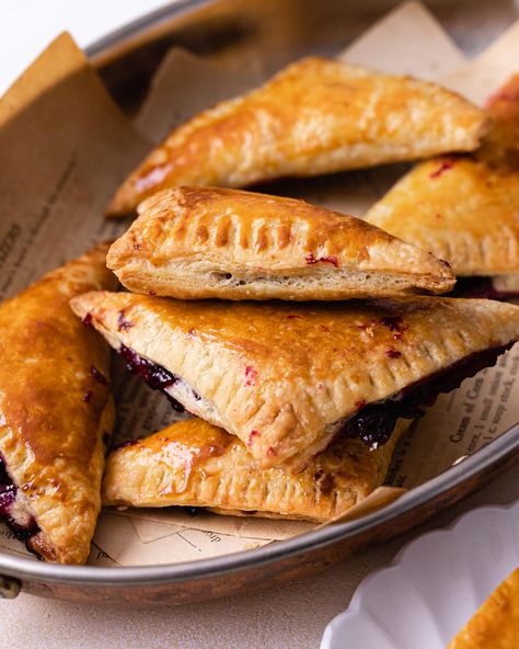 Flaky and buttery with an easy homemade filling, these Sourdough Blueberry Turnovers make for the most delicious treat. Homemade sourdough puff pastry makes these hand pies extra special. Sourdough Apple Hand Pies, Sourdough Discard Turnovers, Plum Turnovers, Sourdough Hand Pies, Sourdough Poptart Recipe, Sourdough Empanada Dough, Blackberry Turnovers With Puff Pastry, Blueberry Danish Recipe Puff Pastries, Blueberry Hand Pies With Puff Pastry