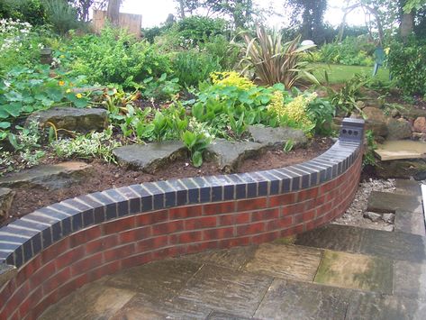 Red Brick Retaining Wall, Red Brick Garden Wall, Curved Garden Wall, Red Brick Raised Garden Bed, Driveway Remodel, Curved Brick Wall, Driveway Wall, Small Brick Patio, Brick Wall Gardens