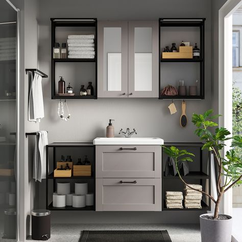 With grey as a base, you create a warm and cosy feeling. Perfect if you want a discreet colour that goes with everything. Modern or classic – you decide the style. The unique wedge dowels make assembly easy and the fittings are nearly invisible. You can easily add ENHET accessories to extend the use of your storage combination. And best of all – you don’t have to drill. Sold separately. This combination offers a harmonious mix of open and closed storage with lots of space to place the things oft Compact Bathroom Design, Small Bathroom Interior, Small Bathroom Sinks, Compact Bathroom, Ikea Bathroom, Basin Design, Ikea Storage, Mirror Cabinet, Grey Bathrooms