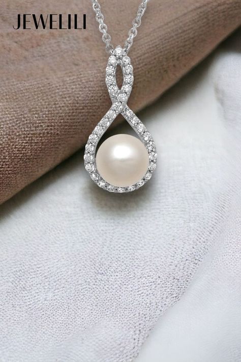 Radiantly eye-catching, this Pendant Necklace will surely add color to her day! This luxury necklace features a 7MM cultured pearl pendant complemented by sparkling round cubic zirconia accents. Crafted from sterling silver, the pendant is ideal for classic and sophisticated looks. This necklace combines timeless design with modern elegance, making it a versatile addition to any jewelry collection. It's a perfect summer travel pick or a Graduation Gift for a June-born loved one! Chain Clothing, Luxury Necklace, Stunning Necklace, Rolo Chain, June Birth Stone, Summer Travel, Modern Elegance, Cultured Pearls, Pearl Pendant