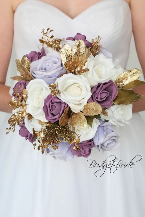 This is a round brides bouquet with white, lavender and wisteria roses accented with gold glitter foliage. All of our wedding bouquets are made with artificial wedding flowers. Nikah Bouquet, Rapunzel Wedding Theme, Lavender Wedding Theme, Mauve Roses, Rapunzel Wedding, Tangled Wedding, Gold Wedding Flowers, Purple And Gold Wedding, Gold Bouquet