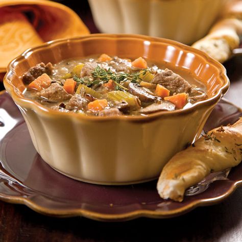 Cozy up to a bowl of this hearty Beef, Wild Rice, and Mushroom Soup to warm up on a cold day. Mushroom Wild Rice Soup Crockpot, Beef Mushroom Wild Rice Soup, Mushroom And Wild Rice Soup Recipes, Wild Mushroom And Rice Soup, Wild Rice Soup With Mushrooms, Wild Rice And Mushroom Soup, Rice Mushroom Soup, Wild Rice Soup Recipes, Ground Beef Rice