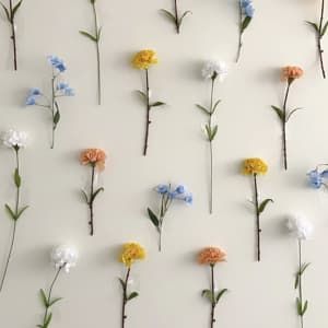 How To Make Your Own DIY Flower Wall Fake Flowers For Wall, Washi Tape Flower Wall, Tape Flowers To Wall, Flower Decoration Bedroom, Floral Background Diy Backdrop Ideas, Dorm Flower Wall, Photo Flower Wall, Taped Flower Wall, Upside Down Flower Wall