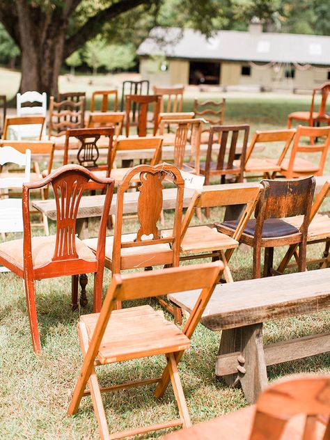 Make your guests feel unique with modern, mismatched seating at your rustic wedding ceremony. Chairs with worn wood have the prime look for the theme. Mismatched Ceremony Chairs, Mismatched Wooden Chairs Wedding, Thrifted Chair Wedding, Thrifted Wedding Chairs, Thrifted Chairs Wedding, Adirondack Wedding Decor, Thrift Shop Wedding, Wooden Wedding Chairs, Wooden Chairs Wedding