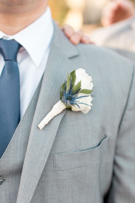 light gray wedding suit with a dusty blue tie and white rose and blue cornflower boutonniere  #weddingphotography #winterwedding #slateandgraywedding #slateblue #groomsstyle #groominspiration #boutonniere Dusty Blue And Light Grey Wedding, Blue Gray Suit Wedding, Grey Suit Blue Tie Wedding, Grey And Blue Wedding Suit, Gray Suit Dusty Blue Tie, Light Gray Tuxedo Wedding, Dusty Blue Tie Groomsmen, Gray Wedding Suit For Groom, Light Gray Wedding Suit